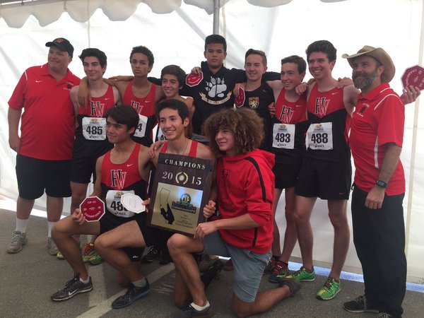 Winner winner: The Boys Cross Country Team poises with their plaque after winning CIF-SS.  Credit: HW Athletics.