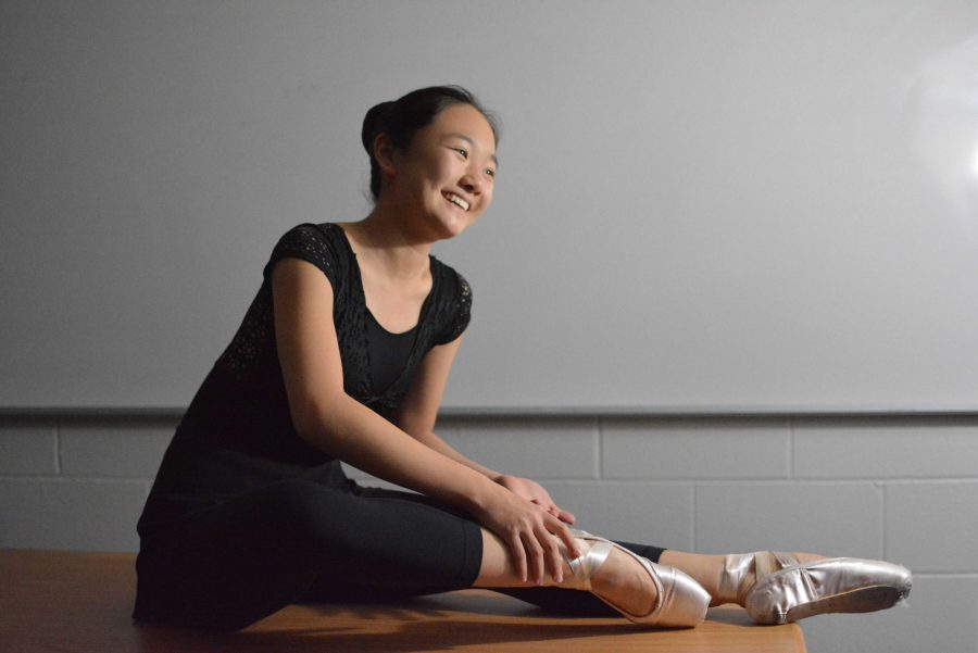 Angel Hoyang 18 ties the ribbons on her pointe shoes as she dresses for rehearsal.
Credit: Kate Schrage 18/Chronicle