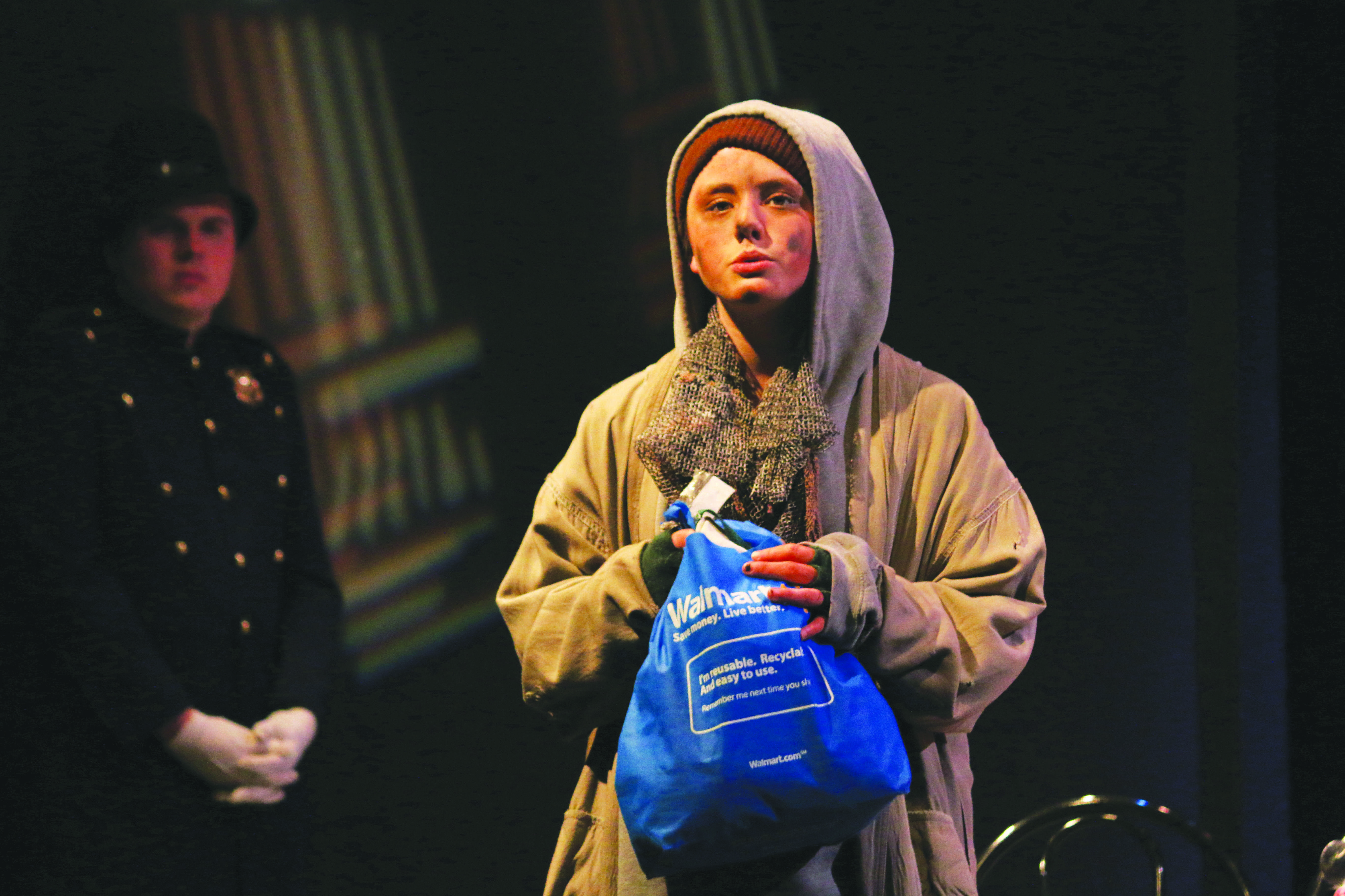SETTING THE SCENE: Lily Beckinsale-Sheen ’17, playing the role of the hobo, laments the state of the world. Credit: Pavan Tauh/Chronicle.
