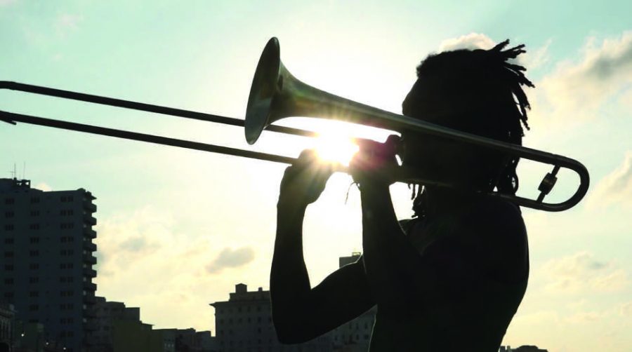 MOVIE MAGIC: The documentary “Embargo on Love” follows a young, female filmmaker who uses her camera to bring love to the once forbidden island of Cuba. The scene shows a man playing his trombone. Printed with permission of Cheri Gaulke