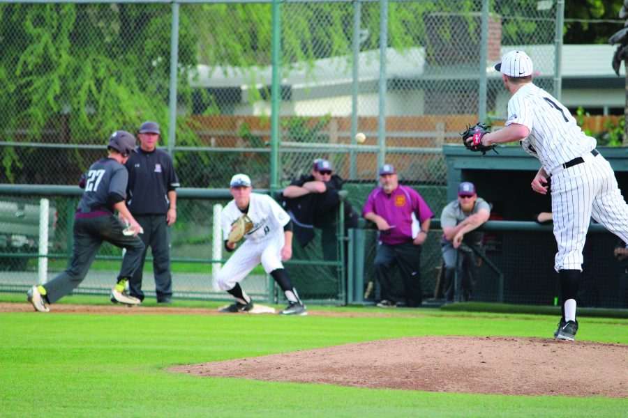 Pitcher Benjamin Geiger 17 attempts to pick off an opponent during a league game. Credit: Bennet Gross/Chronicle