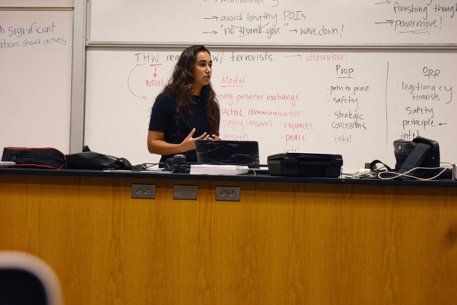 Octavia Tyagi '19 delivers a speech during a practice World Schools debate before her classmates. Printed with permission of Mike Bietz.