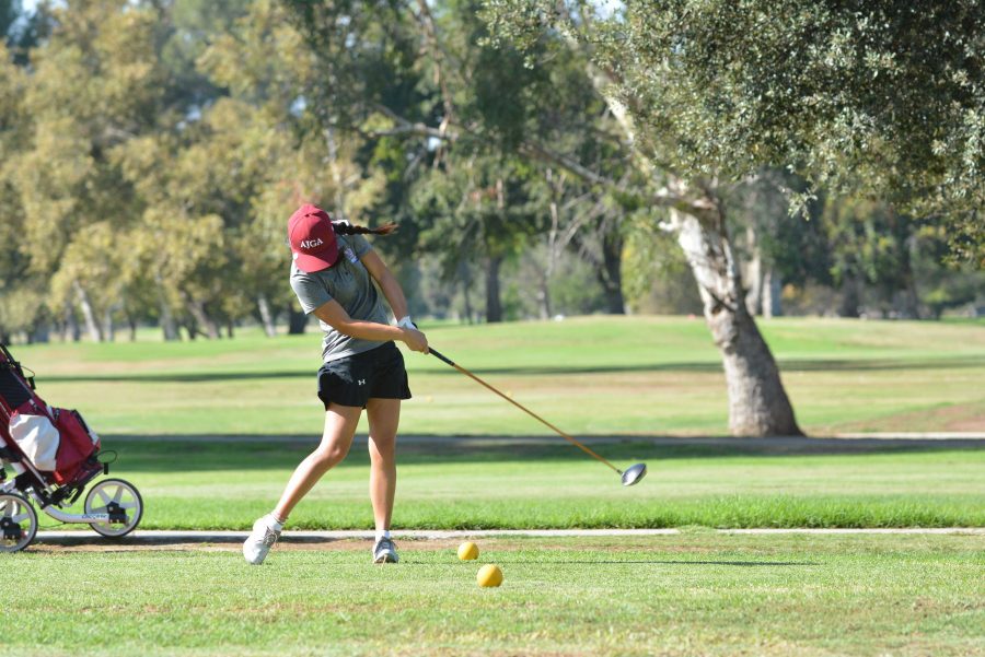 Karina Guo tees off during the Wolverines victory over Notre Dame Sept. 22 Credit: Aaron Park/Chronicle