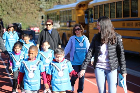 Jordan Goldstein 17 leads a group of preschoolers to Ted Slavin Field in advance of a Special Olympics event. Credit: Pavan Tauh/Chronicle