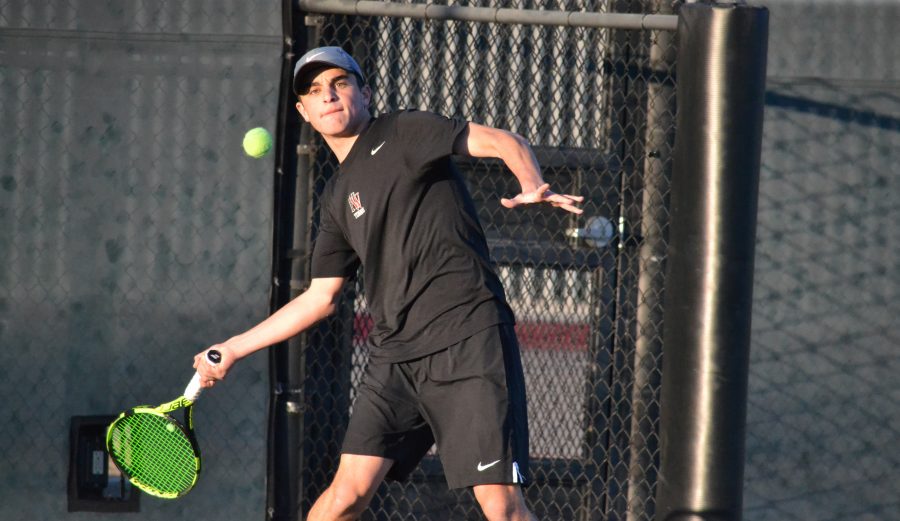 Adam Sraberg 17 returns a serve during the squads 16-2 victory Thursday.