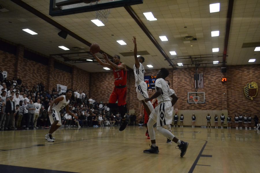 Cassius+Stanley+drives+to+the+basket+in+3rd+quarter+of+CIF-Southern+Section+Division+1A+semifinal+against+Loyola.+%28Aaron+Park%2FChronicle%29