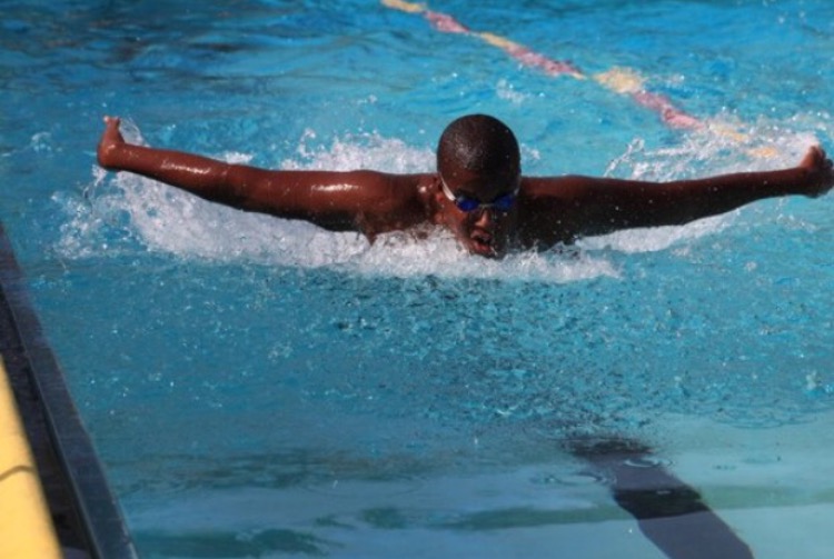 Justin Carr '14 swimming the butterfly, his favorite stroke. (Used with permission of Susan Carr)
