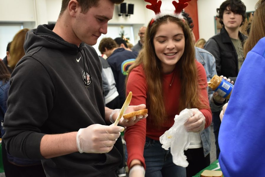 RJ+Schreck+18+and+Ryan+Stanford+19+make+sandwiches+for+the+homeless+during+WinterFest.+Credit%3A+Astor+Wu%2FChronicle