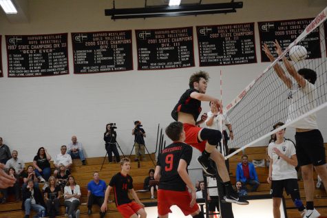 Middle hitter Cole Welch 19 spikes the ball. Credit: Jackie Greenberg/Chronicle