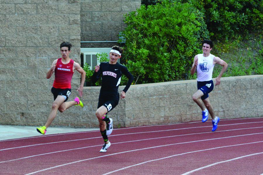 %28Left+to+right%29+Bradyen+Borquez+19+and+Jack+Riley+19+compete+in+the+200-meter+race+in+the+race+against+Loyola.+Photo+Credit%3A+Ryan+Kim%2FChronicle