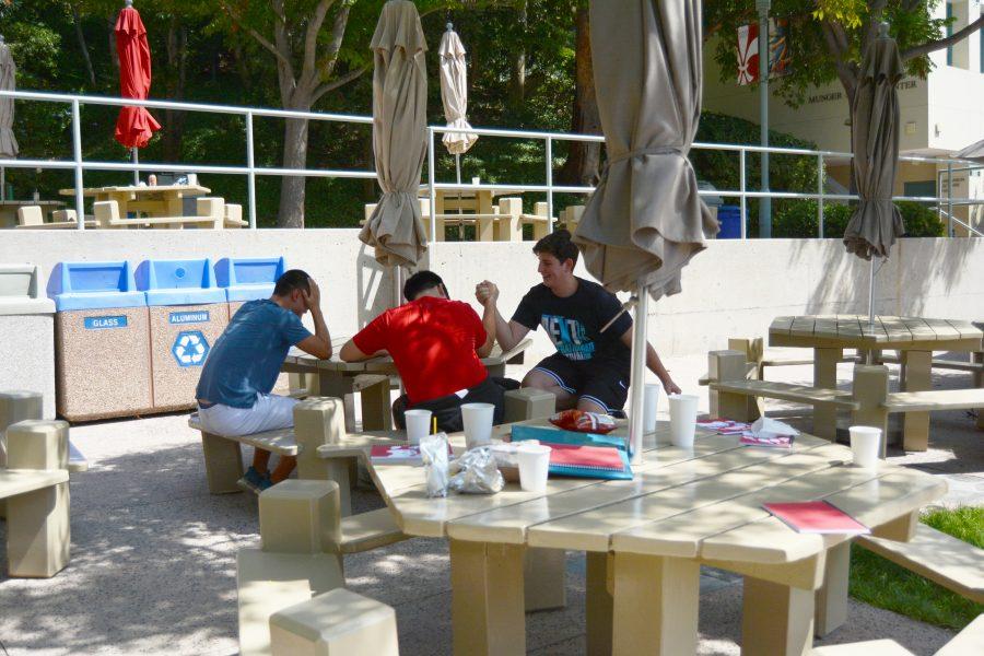 Students+sit+amidst+the+littered+tables+of+the+quad.++Credit+Caitlin+Chung%2F+Chronicle