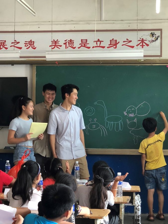 Stephanie Cho 20, Anthony Cho 17 and Steven Zhao 19 instruct students in the classroom.  Printed with permission of Steven Zhao.