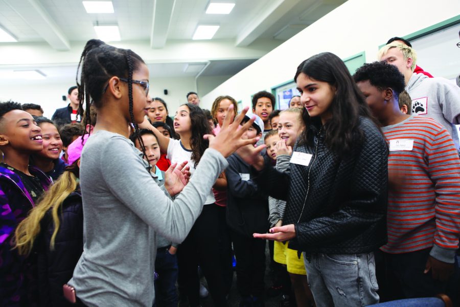 Two prospective students play a game of rock-paper-scissors at the Multicultural Fair. The event was hosted by the Student Ambassador program with the purpose of creating an inclusive environment for applicant families of color.   Credit: Caitlin Chung.