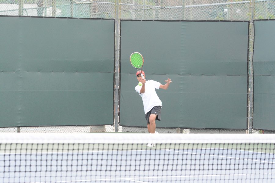 Amaan Irfan 21 returns a serve in his doubles match with teammate Avi Carson 22. The squad beat St. Francis 13-5 Tuesday.