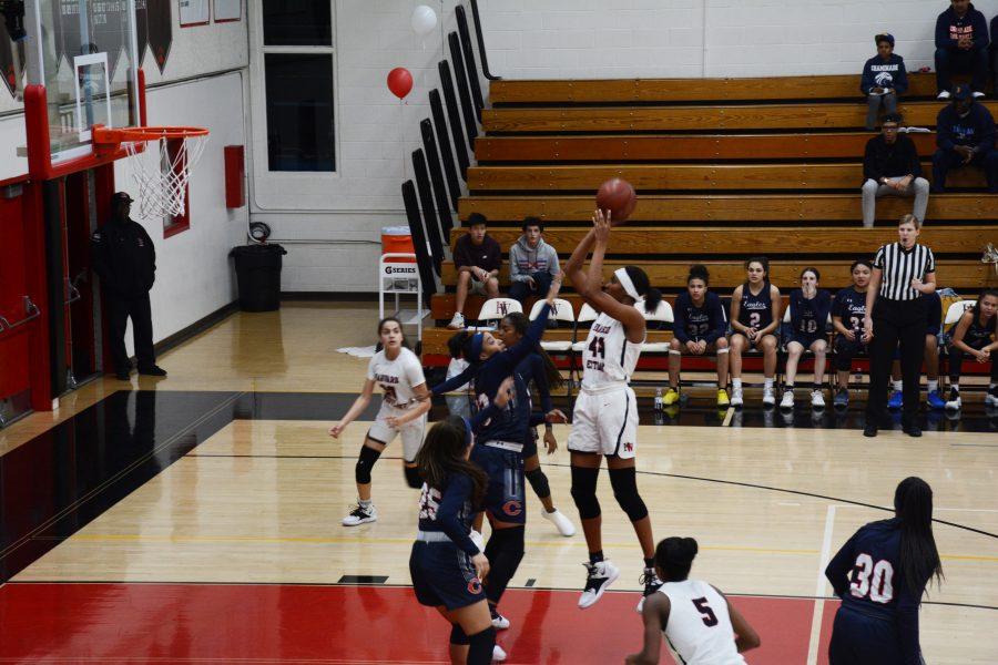 Star Forward Kiki Iriafen 21 jumps and shoots against Chaminade High School on Jan. 29. (Credit: Will Mallory/Chronicle) 