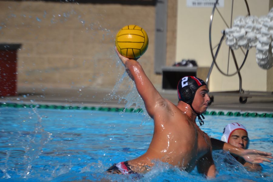 Defender Nicholas Tierney 20 lifts up to shoot the ball in the 13-4 win against Palos Verdes High School today. Credit: Sandra Koretz/Chronicle.