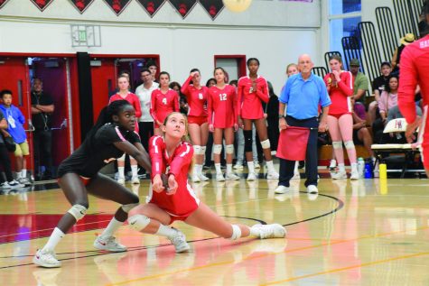 Captain and libero Josephine Amakye ’21 and outside hitter Ava-Marie Lange ’23 lunge for the ball in order to keep the rally. The girls won against the Buckley School for Girls 3-0. Credit: Eugean Choi/Chronicle