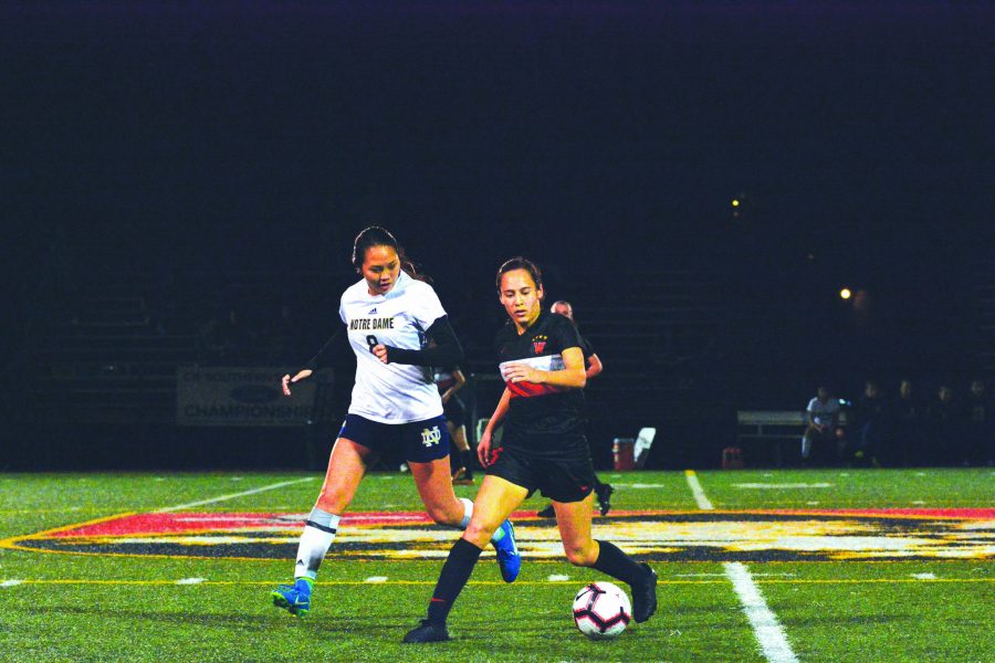NAT ATTACK: Natalie Barnouw ’21 protects the ball against a Notre Dame High School defender on senior night in a 1-0 win in the last Mission League game of the season at Ted Slavin Field. Credit: Lucas Lee/Chronicle