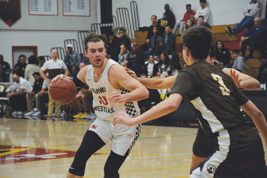 Forward Trumann Gettings ’21 looks for an opening to drive to the hoop Jan. 22. The team won 54-51 after falling behind 18 points against Crespi Carmelite High School. The team’s next game is against Chaminade College Preparatory tonight. Photo: Kyle Reims/Chronicle