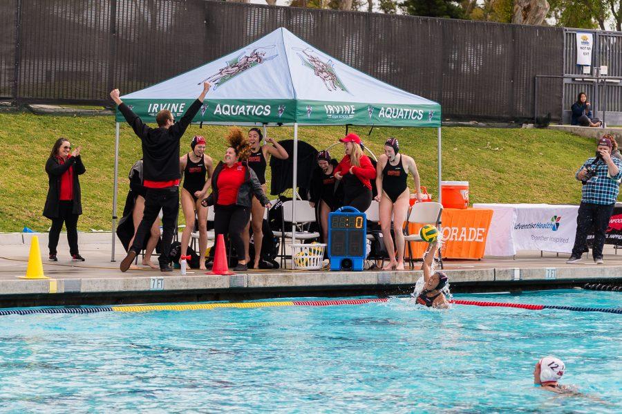 Matt Kubeck and the girls water polo team celebrate as time expires in the CIF Division II Finals.  Credit: Wu Sim
