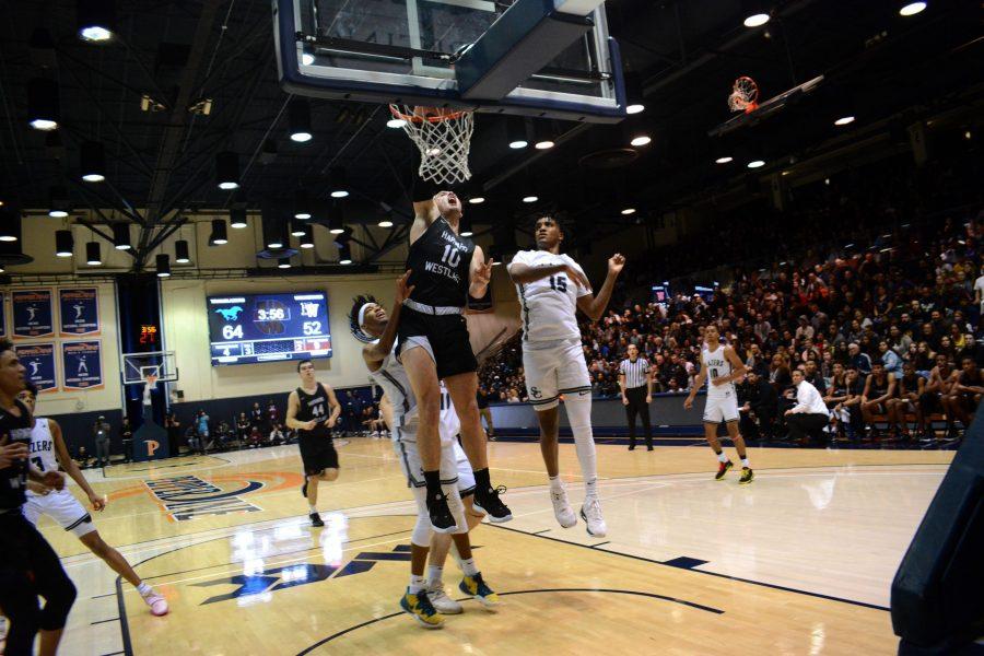 Power forward Trumann Gettings throws down a dunk against Sierra Canyon. The Wolverines lost, 75-65. Credit: Kyle Reims/Chronicle