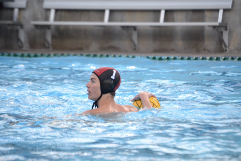 Baxter Chelsom 23 drives up the pool and attempts to shoot the ball in the game against Mira Costa High School. 