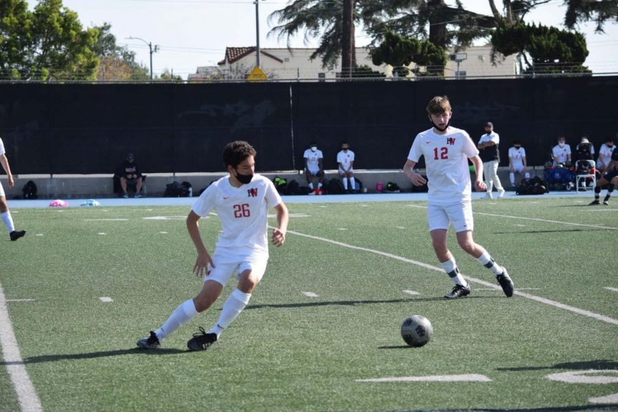 Asher Rossen 23 and John North 21 get ready to coordinate an attack against Loyola High School on April 5. 