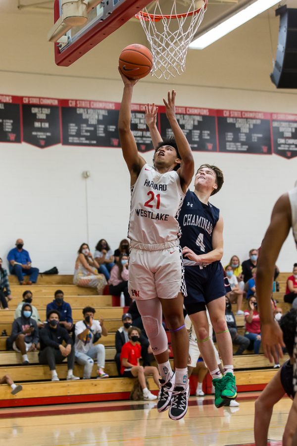 Adam Hinton goes up for a layup in a game against Chaminade College Preparatory High School on May 12. 