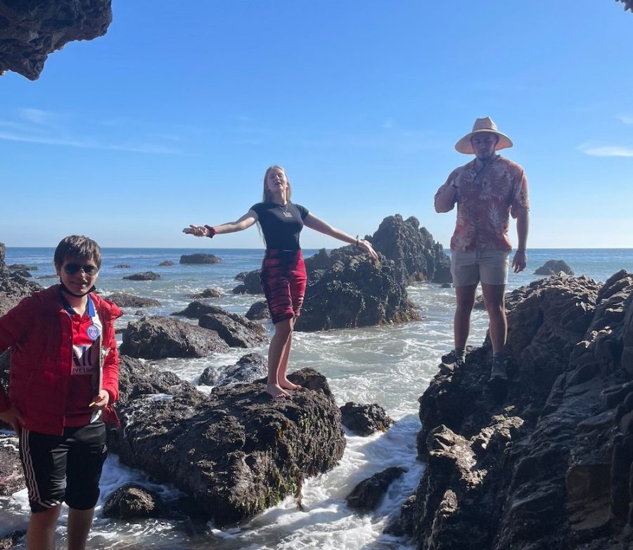 From left to right: Advanced Placement Environmental Science students Manu Markman ’23, Alex Astalos ’23 and Jesse Goldman ’23 explore a sea cave on their Nov. 15 trip.