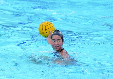 PRACTICE MAKES PERFECT: Attacker Jasmine Tang ’24 looks back at Girls Water Polo Program Head Jennifer Jamison during a drill at team practice Dec. 9. Tang and the squad are preparing to play their first league match of the season against Marymount High School on Jan. 6.