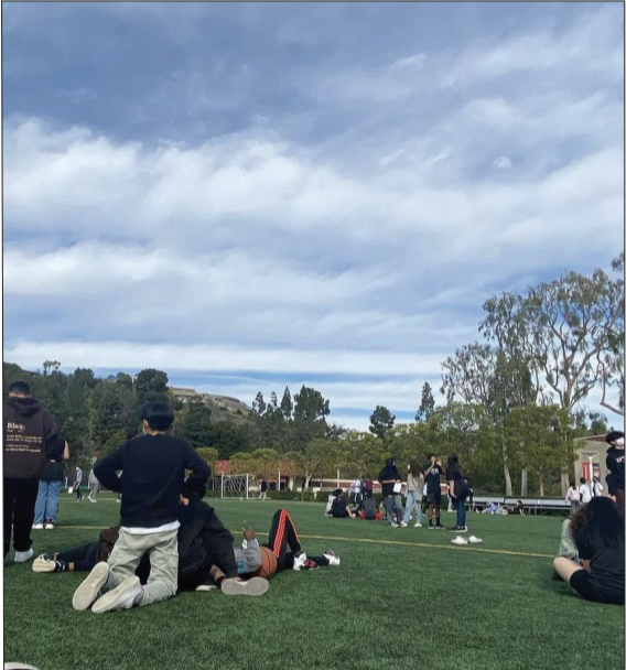 Middle School students gather on Sprague field after evacuating from a gas leak that occurred at a nearby construction site.
