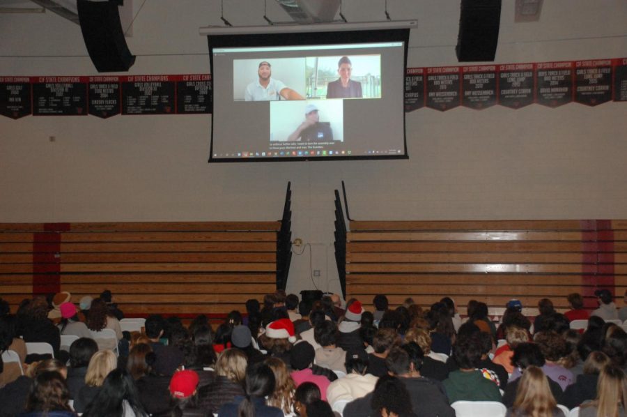 During the Community Flex time, students watch  a projected Zoom meeting where Maxey and Colson expand on DEAFinitely Dopes mission. 