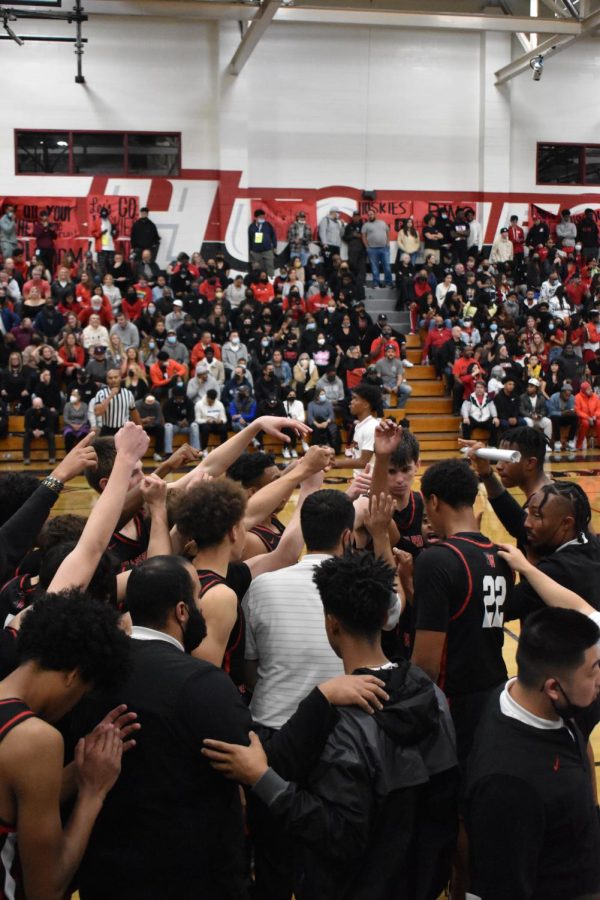 The+boys+basketball+team+huddles+up+during+a+timeout+in+its+match+against+Corona+Centennial+High+School+in+the+final+of+CIF+SS+Open+Division+Playoffs.