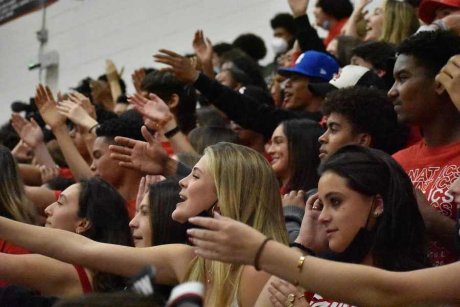 Fiene Oerlemans ’22 and Deven Dees ’22 chant alongside other Fanatics at the boys basketball game against Sierra Canyon School on Feb. 18. The school limited the number of attendees at the playoff game, where the school fell to the Trailblazers 72-55.