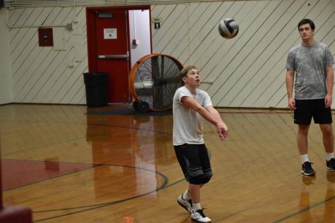 Setter Andrew Eitner 23 lifts a ball for his teammate and outside hitter Erik Steuch to crush down the center of the court. They practice for their upcoming league match against Notre Dame on March 15. 