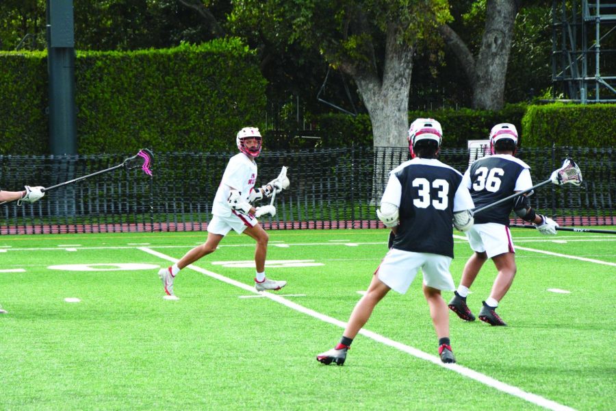 BREAKOUT PLAYER: Attacker Beckett Lee ’24 cradles the ball before a 5-4 overtime win against Crespi Carmelite High School on March 16.