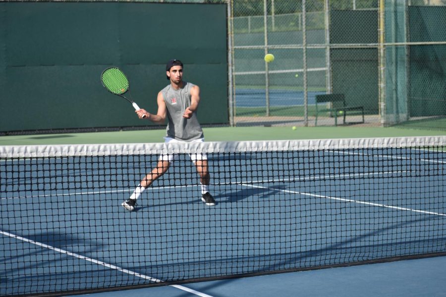 Singles+and+doubles+player+Jordan+Assil+%E2%80%9922+runs+to+the+net+for+a+volley+in+preparation+for+the+team%E2%80%99s+11-7+loss+to+Calabasas+High+School.+The+squad+started+the+season+7-0+overall+before+losing+to+Crespi+Carmelite+High+School+11-7+March+15.+The+team%E2%80%99s+overall+record+stands+at+8-2.