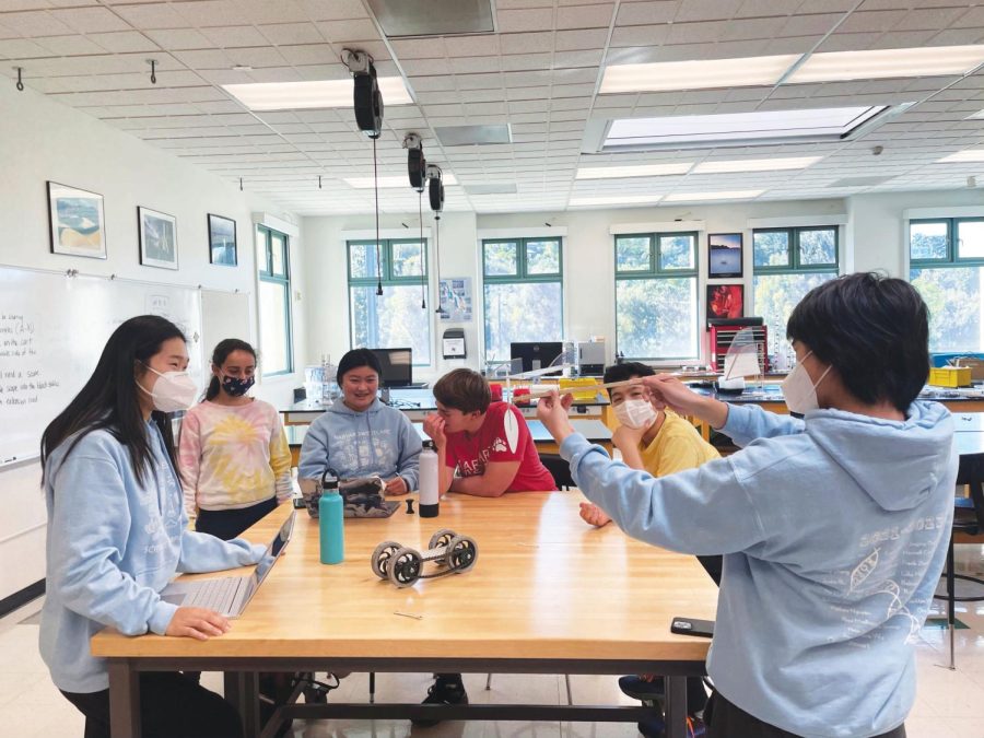 Kensuke Shimojo ’23 displays a handmade plane to fellow members of the Science Olympiad team. The team recently qualified for the Southern California State Tournament following success at regionals.