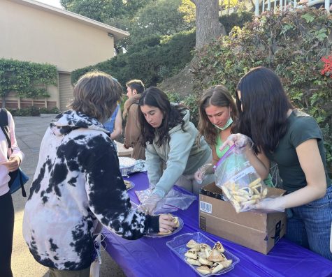 Members of the Jewish Club gather hamantaschen for students participating in the fundraiser.