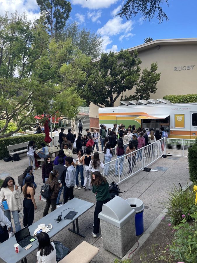 Students wait in line during lunch for the Plant Power Food Truck hosted by Environmental Club.