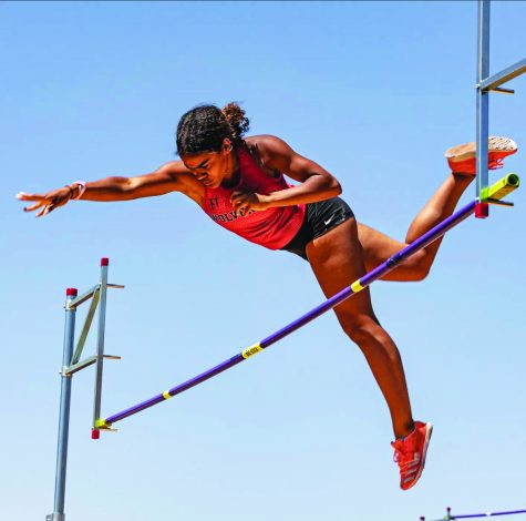 JUMPING FOR JOY: Jessica Thompson ’23 pole vaults in a track meet against Fontana High School. Thompson placed first in Mission League for pole vault and long jump, setting the school pole vault record at 12 feet 8 inches.