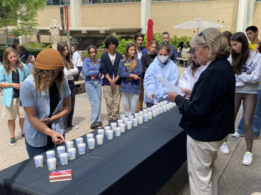 Reverend Anne Gardner leads students and faculty in a candle lighting ceremony in honor of Yom HaShoah.