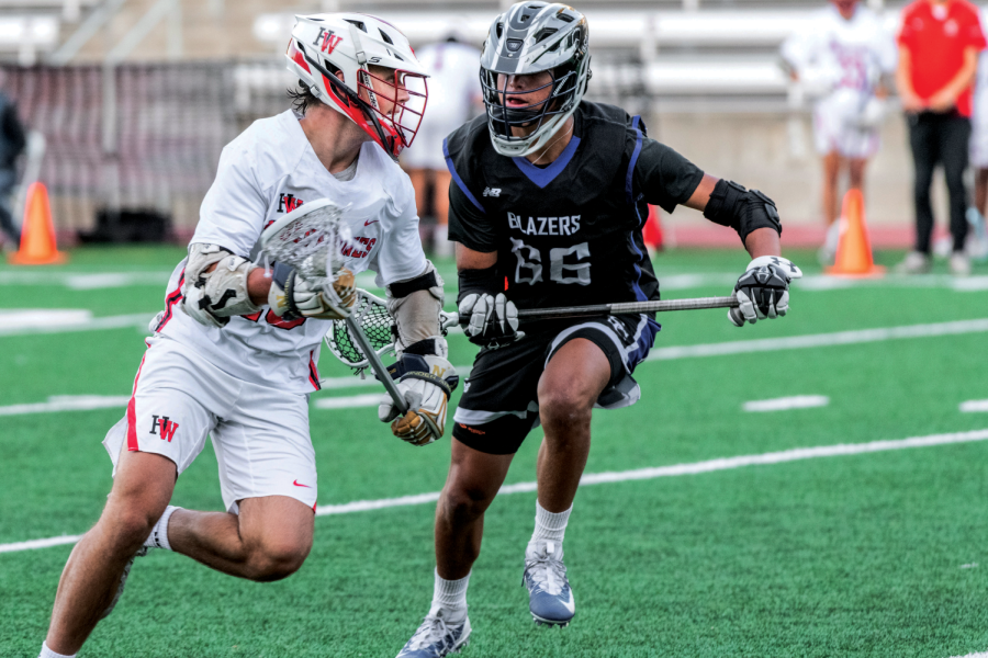 STICK TO THE SCRIPT: Midfielder Ben Webber ’22 takes on a defender before passing to a teammate in a match against Sierra Canyon High School. The team ended its season with a 10-9 loss against Tesoro High School in the first round of CIF Southern Section Division I playoffs May 2. 