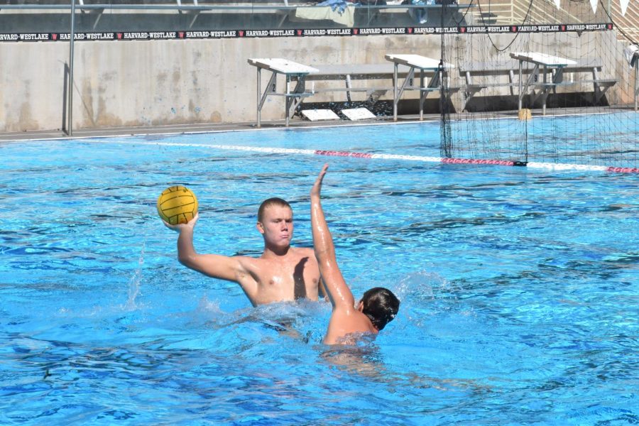 OTTO-MATIC: Otto Stothart ’26 attempts a shot on goal during a boys water polo preseason practice on Aug. 16. Team players have competed against college athletes at all of the practices. The varsity team’s first match was a home game against Crespi Carmelite High School on Aug. 22.