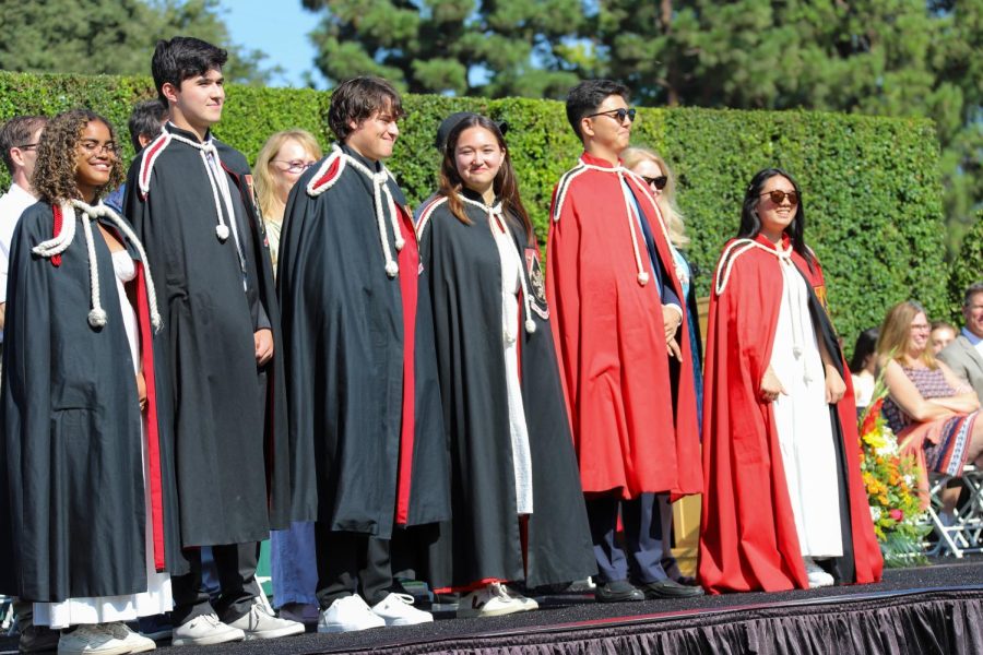 RADIANT IN ROBES: Head Prefects Yoshimi Kimura amd Simon Lee and Senior Prefects Aiko Offner, Harry Tarses, Rowan Jen and Jessica Thompson stand before the community after being robed by their faculty sponsors. 