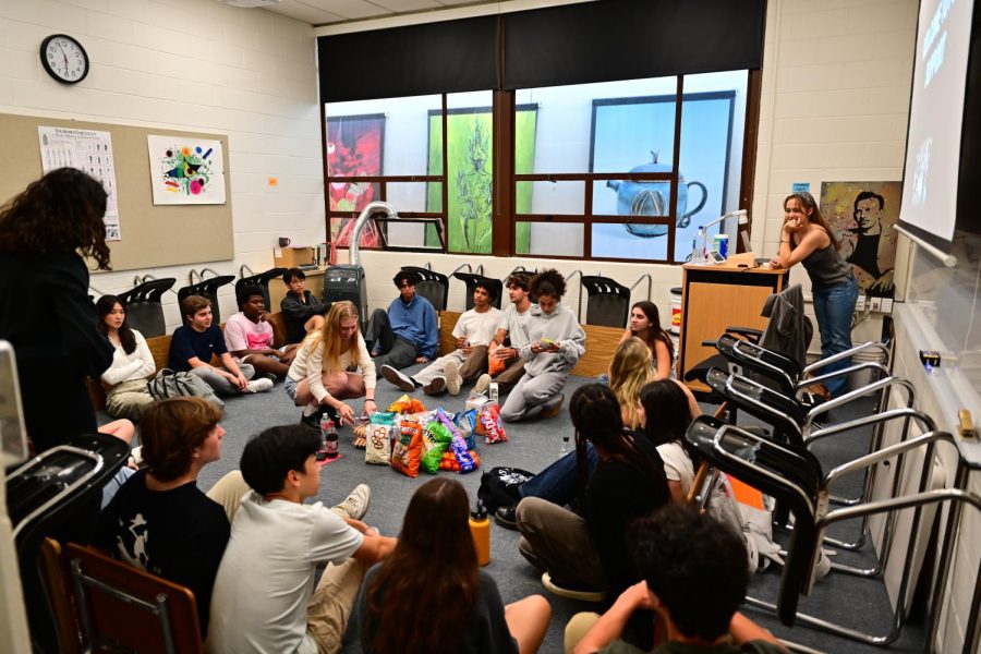 A Peer Support group, led by junior trainees and senior leaders, meets in a Rugby classroom for their first meeting of the year. 