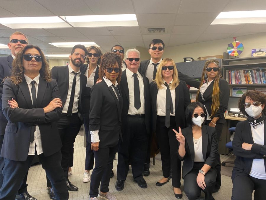 BACK In BLACK: Language Department teachers dress up in costume for the Halloween costume contest. 