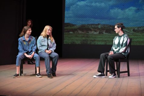 Carter Staggs ’23, in character as Tectonic Theater Project member Greg Pierotti, interviews Elise Fried ’24 and Clara Berg ’25, in character as Reggie Fluty and Marge Murray, respectively. The play uses the real words of Laramie residents gathered through interviews. 