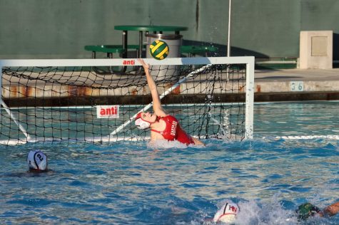 REACH FOR THE STARS: Goalie Thea Pine ’23 stretches upwards to save a goal during a game against Mira Costa High School on Dec. 3.