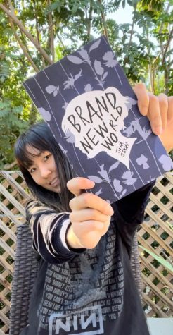 Jeon poses with her new book Brand New World. Her book, available on Amazon, combines elements of Greek mythology, tragedy and dark academia. 